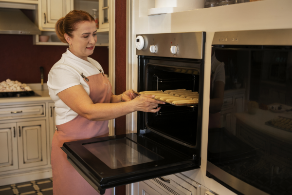 female-confectioner-baking-with-dough-pastry-shop